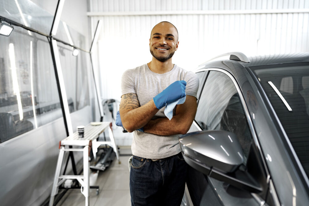 man in business casual shirt smiling